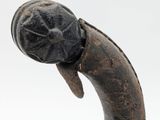 sculpture of a head of a snake on a white background