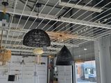 a room with a lot of hanging objects on the ceiling