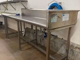 an image of a commercial kitchen with stainless steel sinks