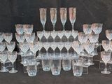a lot of wine glasses that are sitting on the table