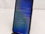 the back of a black iphone with a display on the screen