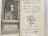 an old book with a picture of a man sitting in a chair