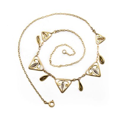 a close up of a necklace and bracelet on a white background