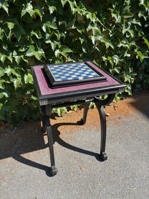 a small table that has a chess board on it