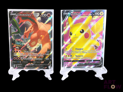 two pokemon cards sitting side by side on top of each other