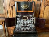 a wooden cabinet with a wine glass set in it