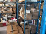 a blue cart with boxes on it in a warehouse