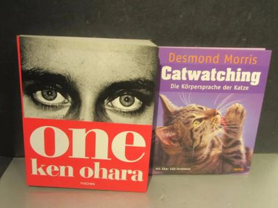 two books that are sitting next to each other on a table