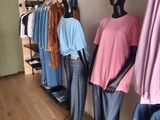 mannequins are lined up in a row in a clothing store