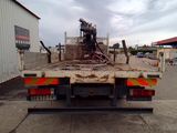 an image of a flatbed truck parked in a parking lot