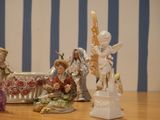 many figurines of angels sitting on a table