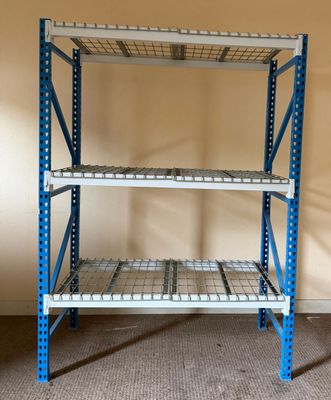 a close up of a metal shelf in a room