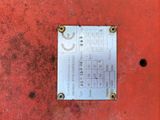 an image of a piece of metal on a red surface