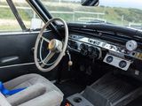 a dashboard and steering wheel of a car in a car show