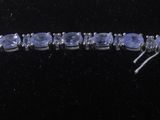 a close up of a bracelet on a mannequin display