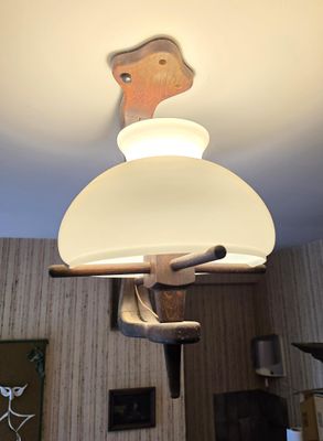a lamp that is hanging from the ceiling in a room