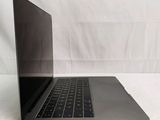 an open laptop computer sitting on top of a white surface