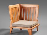 a wooden chair with a cushion on top of it