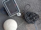 a white ball and a black and white ball on the ground