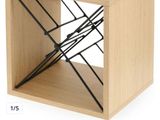 a small wooden box with a wire rack on it