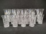 a lot of glasses that are sitting on a table