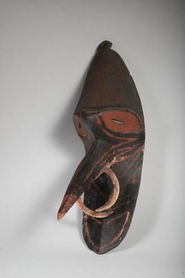 an image of a wooden mask on a white background