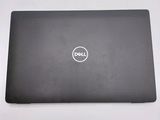 the dell laptop is sitting on a table with its lid open