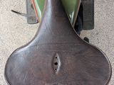 a close up of a motorcycle with a helmet on the back of it