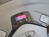 a close up of a machine with a clock on it