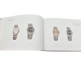 an open book with a picture of watches on it