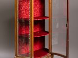 an image of a cabinet with a red velvet covering