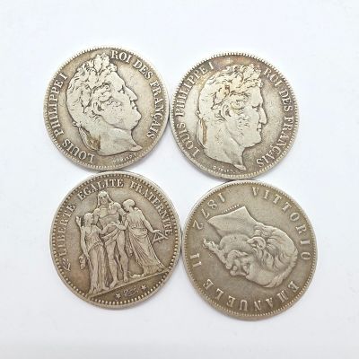 quatre pièces d'argent britanniques, dont l'une est un souverain et l'autre est un souverain