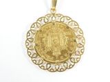 an image of a gold pendant with a coin in the center