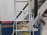 an image of a ladder in a garage with a ladder next to it