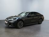 a black bmw x4 parked in a white room