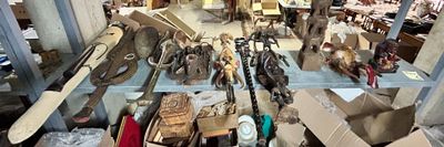 many different types of weapons on display in a store