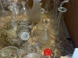 a lot of glass items on a table in a box