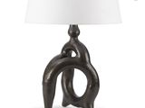 a close up of a lamp on a table with a white shade