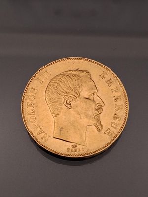 an image of a gold coin with a man ' s face on it