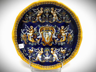 a blue and yellow plate with a design on it