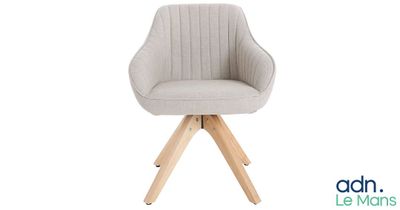 a close up of a chair with wooden legs and a white background