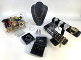 a lot of jewelry on display on the table