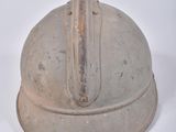 an old helmet on a white table with a white background