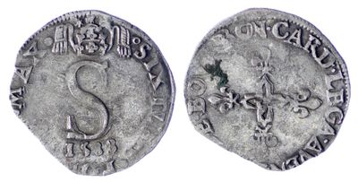 une pièce d'argent sur laquelle figure un serpent au recto et un serpent au verso