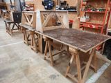 many pieces of wood sitting on a table in a workshop