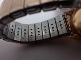 a close up of a wrist with a watch on it