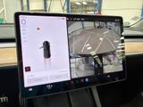 a car dashboard with a monitor and a cell phone in it