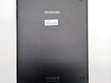 the back of a black samsung tablet with a sticker on it