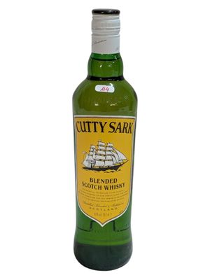 a bottle of whisky sitting on top of a white table