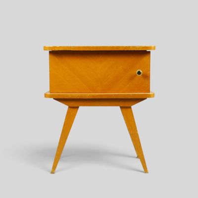an image of a small wooden table with a drawer on it